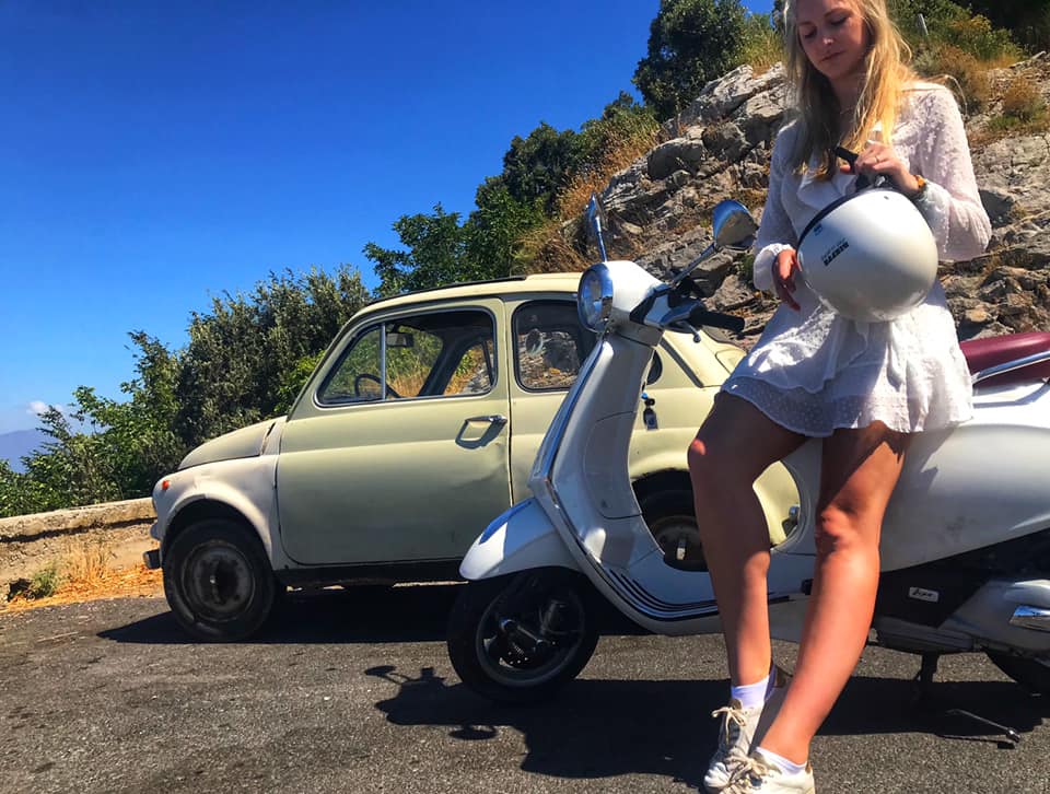A white primavera Vespa 125cc in Italy, Campania, Amalfi - saying goodbye does not exist