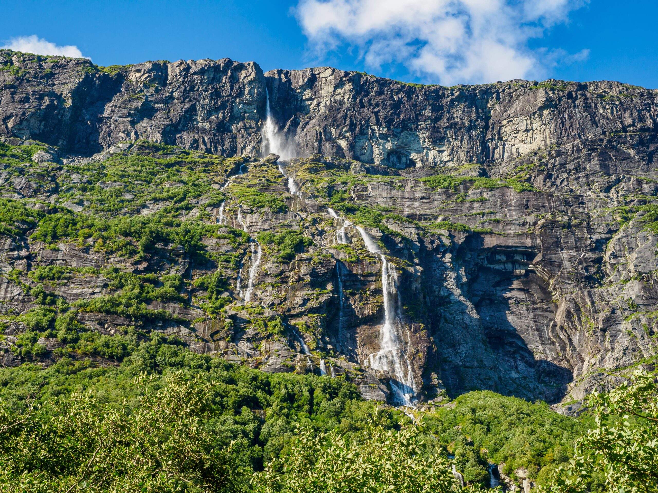 Vinnufossen, a beautiful waterfall flushing down a mountainside in Sunndal, Norway.